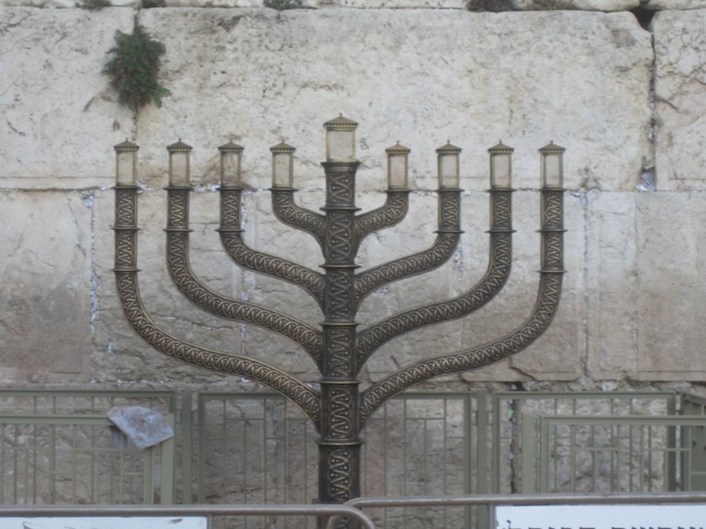 News Sparks: HaRav David Lau Lights First Candle in Kosel Menorah, Biden Hosts Chanukah Party; UK Bans Hamas; and More
